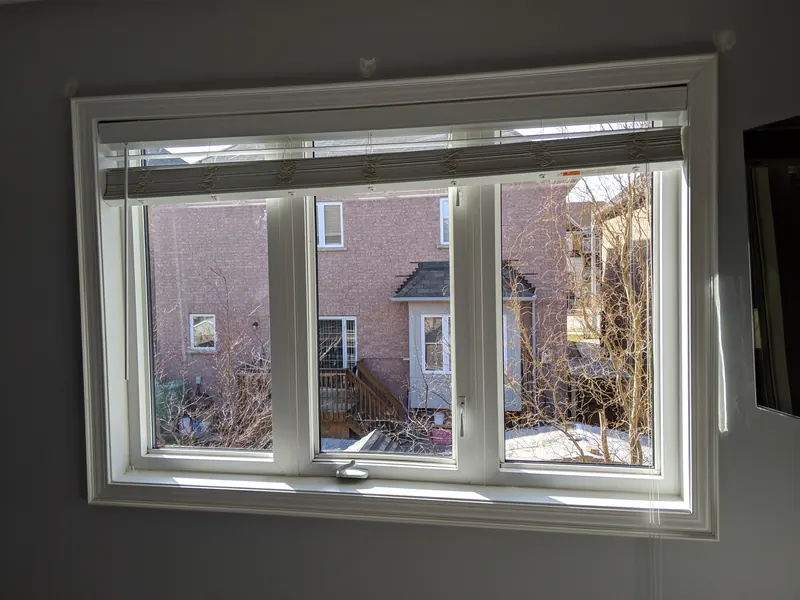 After glass replacement: the same casement window with clear new sealed glass units