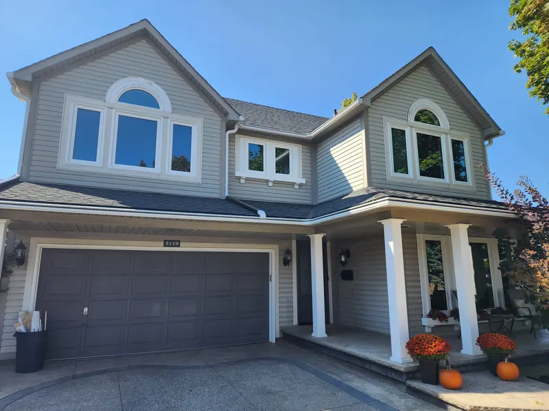 Two-storey home after a window and front door replacement